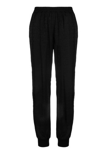 Moschino all over logo-print track trousers - Nero
