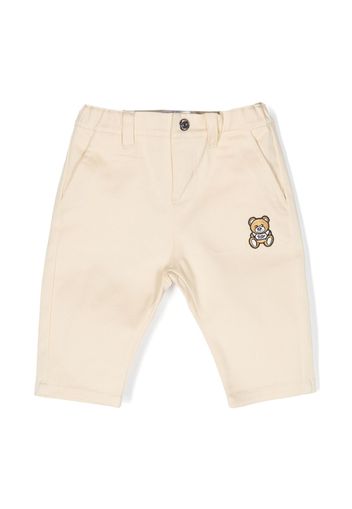 Moschino Kids logo-patch straight-leg chinos - Toni neutri