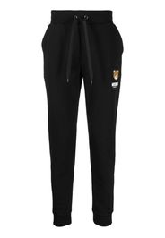 Moschino logo-patch track pants - Nero