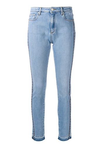 Jeans skinny con banda laterale