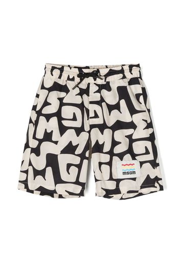 MSGM Kids graffiti logo-print shorts - Toni neutri