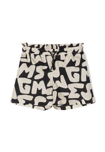 MSGM Kids all-over logo print shorts - Toni neutri