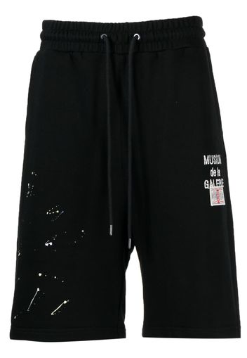 Musium Div. logo-embroidered paint-detail shorts - Nero