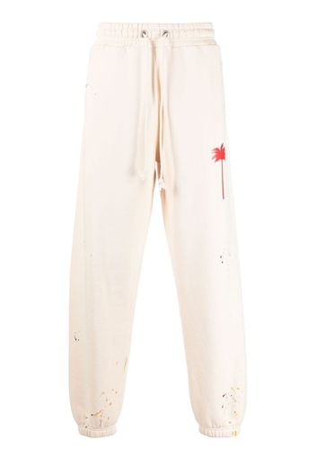 Palm Angels PXP PAINTED SWEATPANTS OFF WHITE RED - Toni neutri