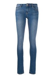 Jeans skinny con applicazione