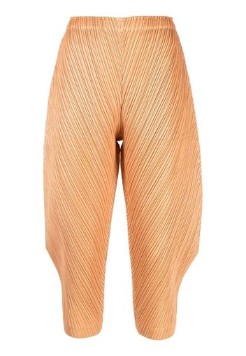 Pleats Please Issey Miyake crease-effect trousers - Arancione