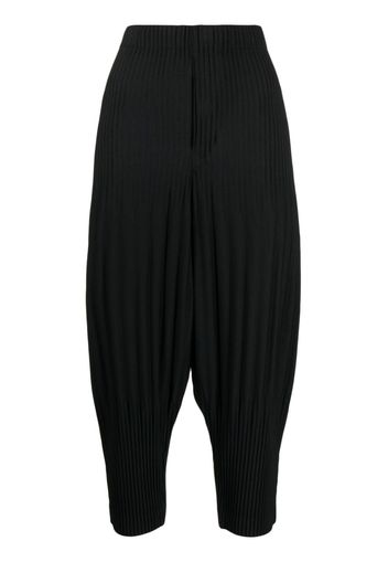 Homme Plissé Issey Miyake plissé cropped drop-crotch trousers - Nero