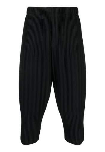 Homme Plissé Issey Miyake pleated tapered cropped trousers - Nero