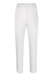 Pleats Please Issey Miyake plissé tapered-leg cropped trousers - Grigio