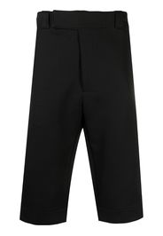 Pantaloni crop con applicazione