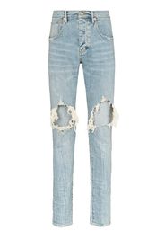 Jeans slim con strappi