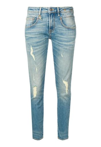 Jeans skinny strappati