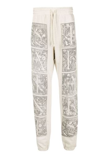 SAINT MXXXXXX graphic-print cotton track pants - Toni neutri