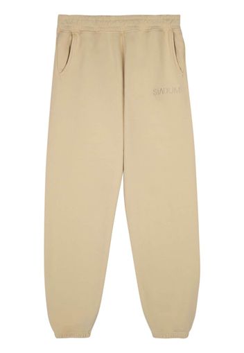 Stadium Goods Eco track pants "Light Khaki" - Toni neutri