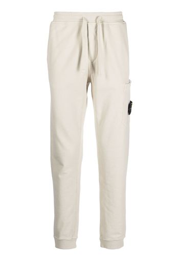 Stone Island Compass-patch cotton track pants - Toni neutri