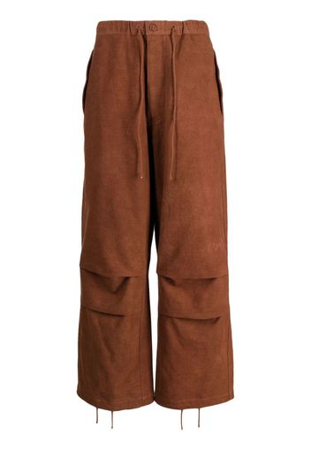STORY mfg. logo-embroidered organic cotton wide-leg trousers - Marrone