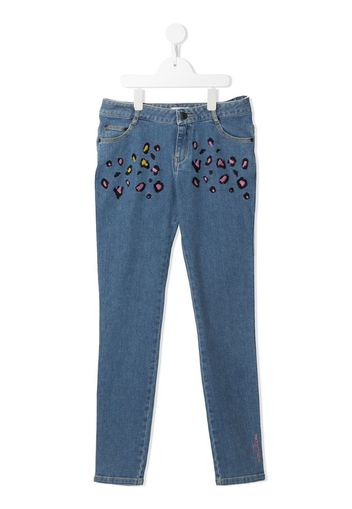 Jeans leopardati con ricamo