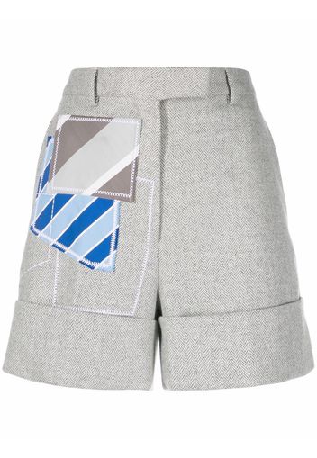 Thom Browne Shorts sportivi con design patchwork - Grigio