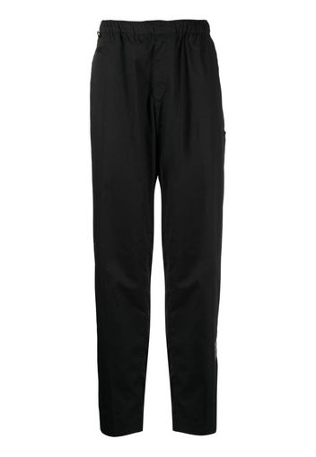 Undercover logo-patch elasticated-waistband trousers - Nero