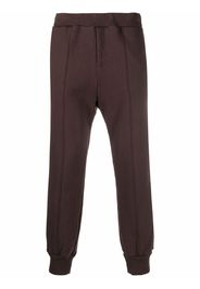 UNDERCOVER exposed-seam cotton track pants - Marrone