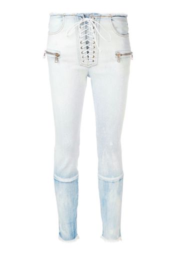 Jeans skinny con lacci