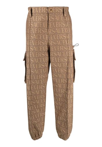 Versace Allover logo-print cargo trousers - Marrone