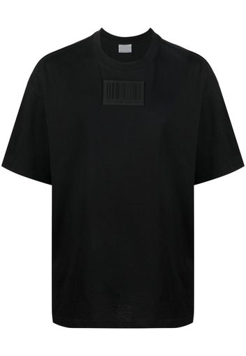 VETEMENTS logo-patch detail T-shirt - Nero