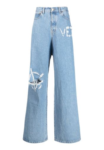VETEMENTS logo-distressed baggy jeans - Blu