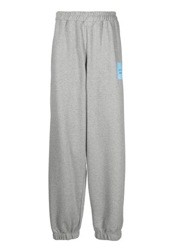 VETEMENTS logo-print wide-leg track pants - Grigio