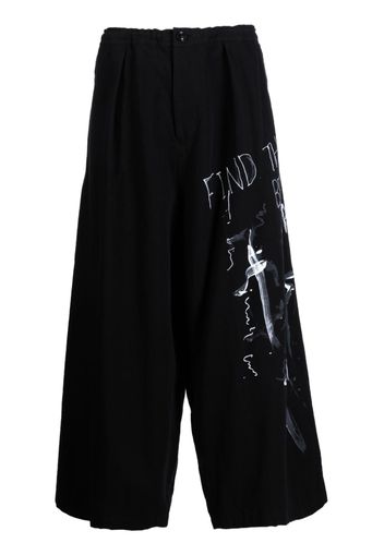 Y's slogan-print cropped trousers - Nero