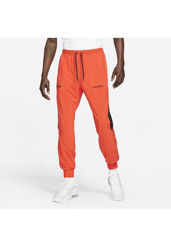 Track pants da calcio in tessuto Nike F.C. - Uomo - Rosso