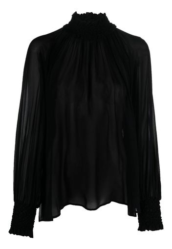 Blusa semitrasparente collo alto