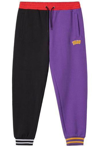 FUBU Pantaloni  lilla scuro / rosso fuoco / nero / bianco / arancione chiaro