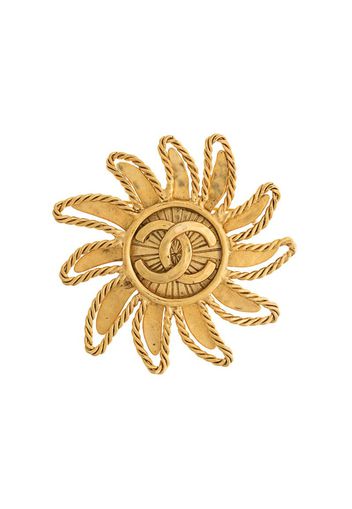 1994 CC sun motif brooch