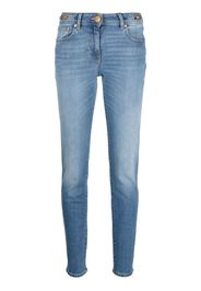 Versace low-rise Medusa Head-motif skinny jeans - Blue