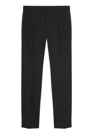 Versace logo--appliqué tapered chino trousers - Black