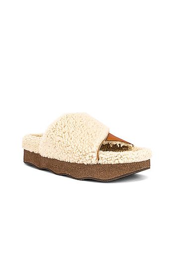 Chloe Wavy Shearling Slides in Beige