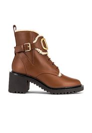 Valentino Garavani VLogo Signature Combat Boots in Brown