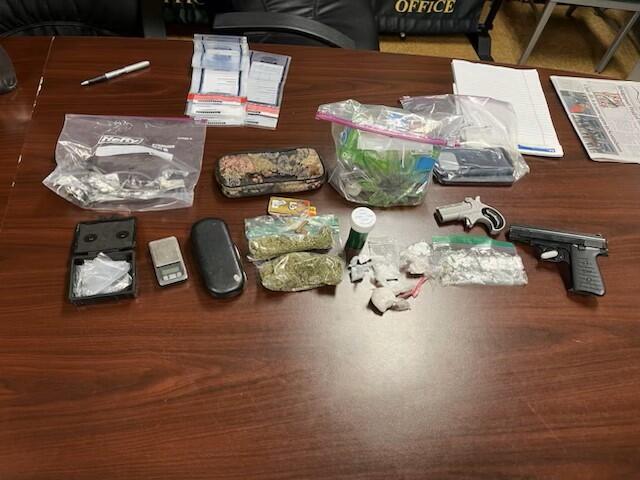 Various drugs, paraphernalia, and guns that were seized