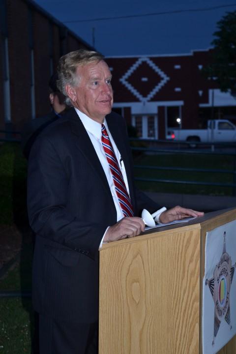 Circuit Judge John H. Bentley standing at a podium.