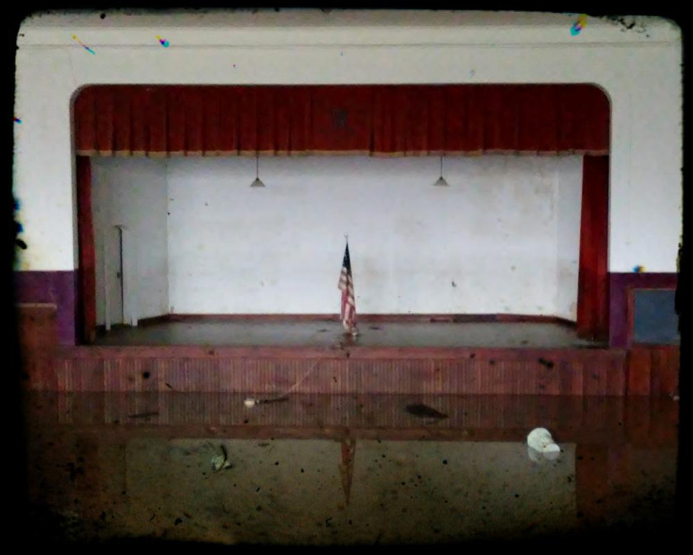 An American flag hanging center stage.