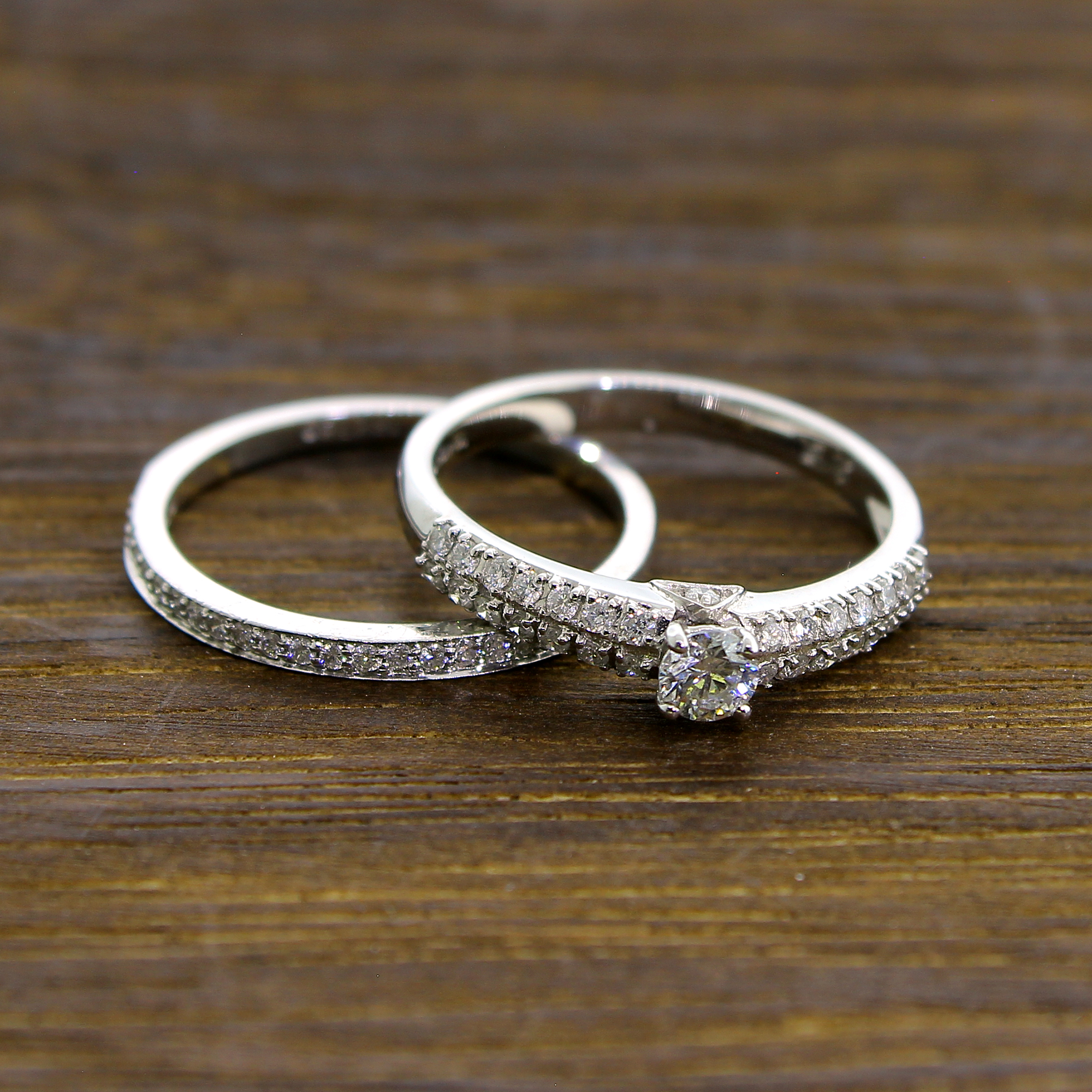 18KT White Gold 3.97g, 0.20 Center Diamond and 52 0.45 Diamond Unity Size 6.5 Ring