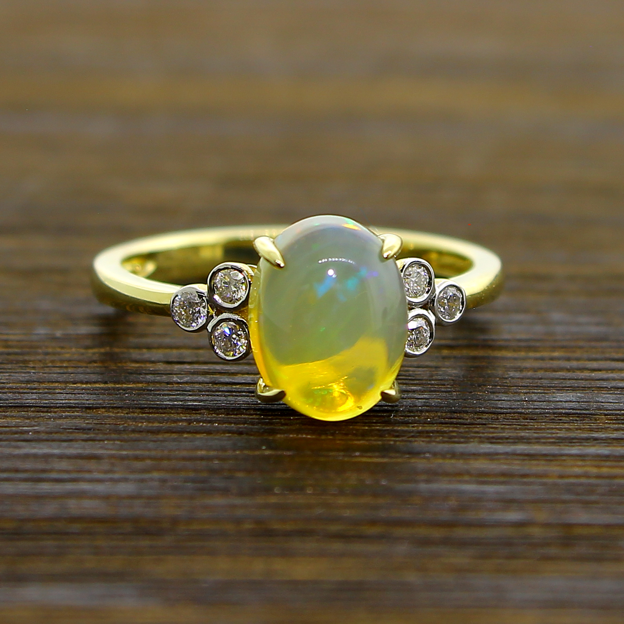 14KT Yellow Gold 2.20g, 1.31CT Opal and 6 0.11CT Diamond Size 6.5 Ring