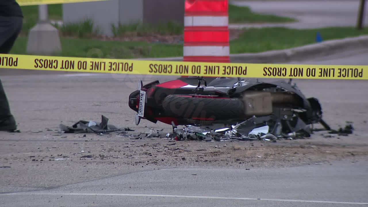 Motorcycle and dump truck collide, causing injury