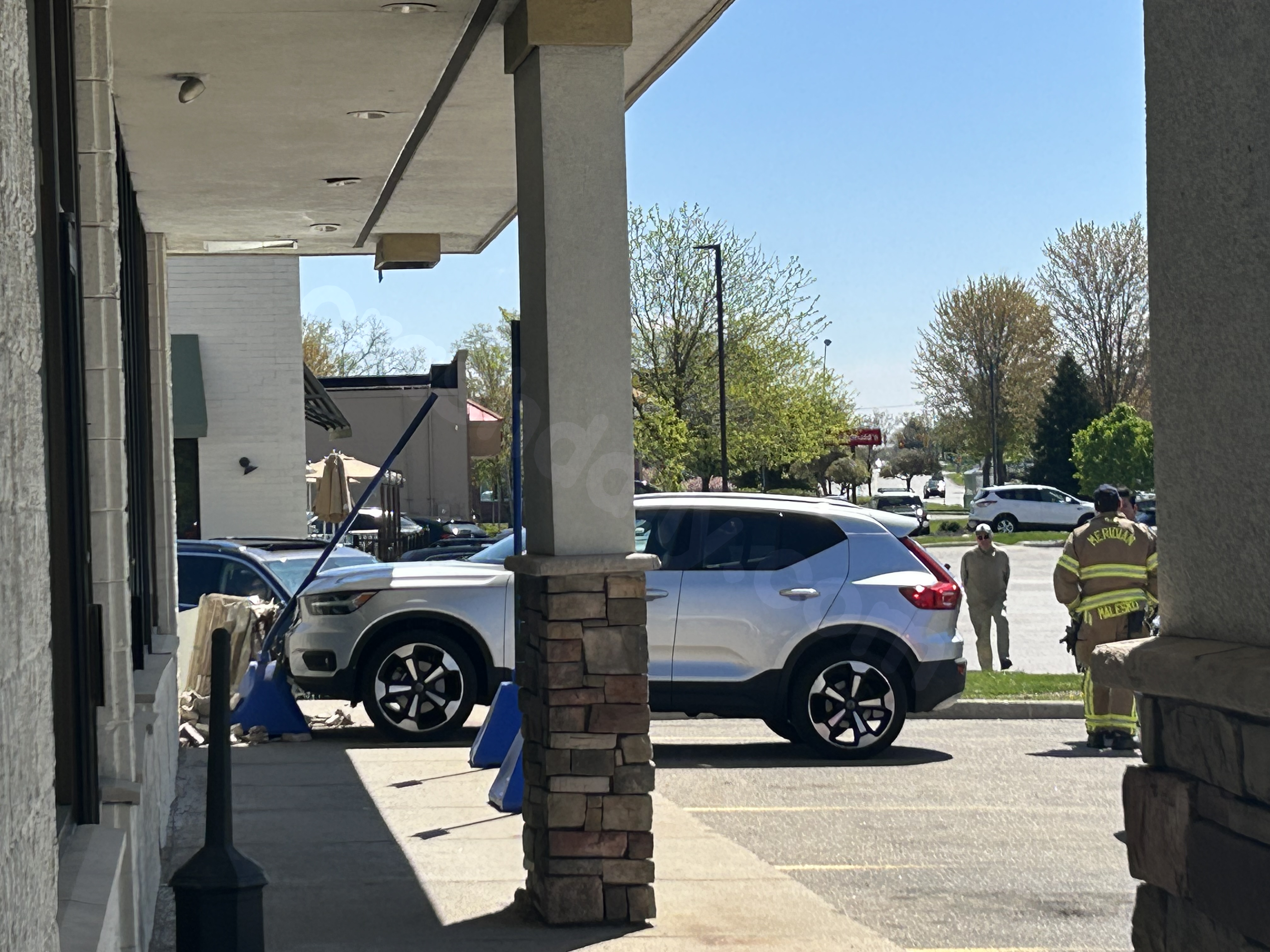 Vehicle collides with structure on Okemos Road