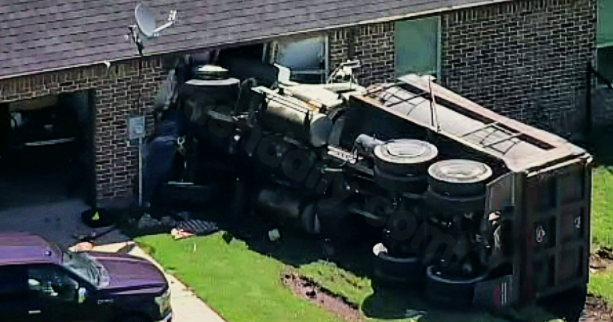 Dump truck collides with house in northern Tarrant County, officials report