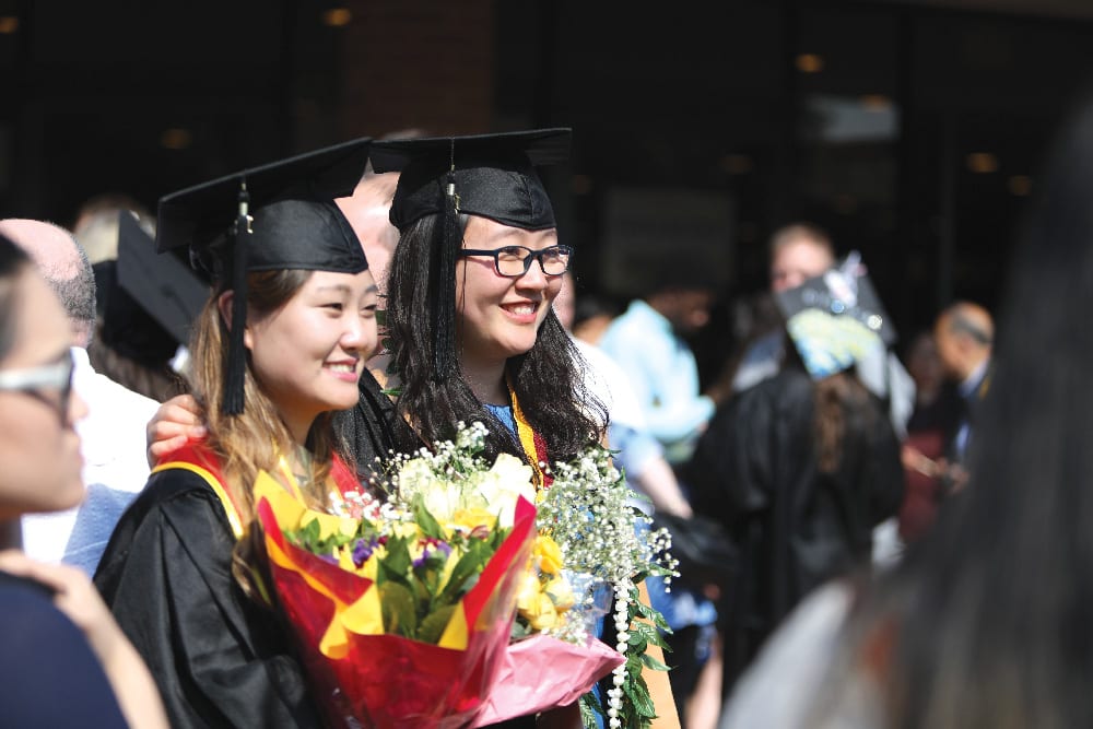 Two students graduating