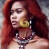 A beautiful woman from the Papua ethnicity with red hair and accessories such as a necklace or earrings-733605660