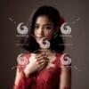 A beautiful young Indonesian girl dressed in a red lace dress kebaya-837455