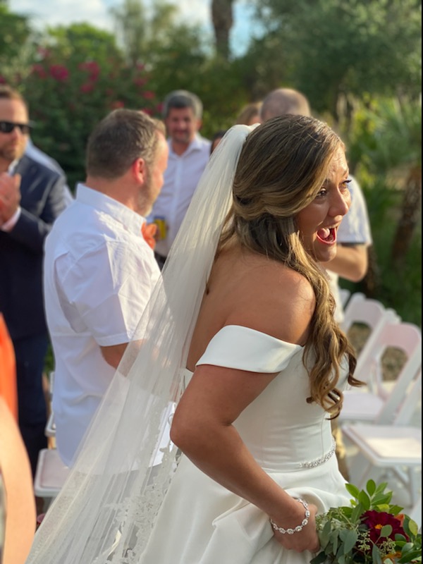 bride in aisle with bouquet